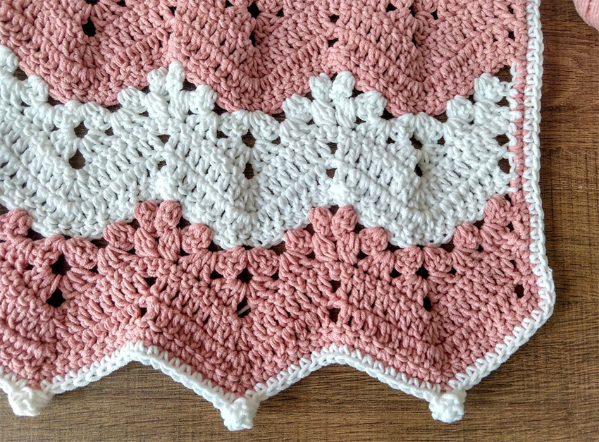 White and pink chevron crochet banklet over the table